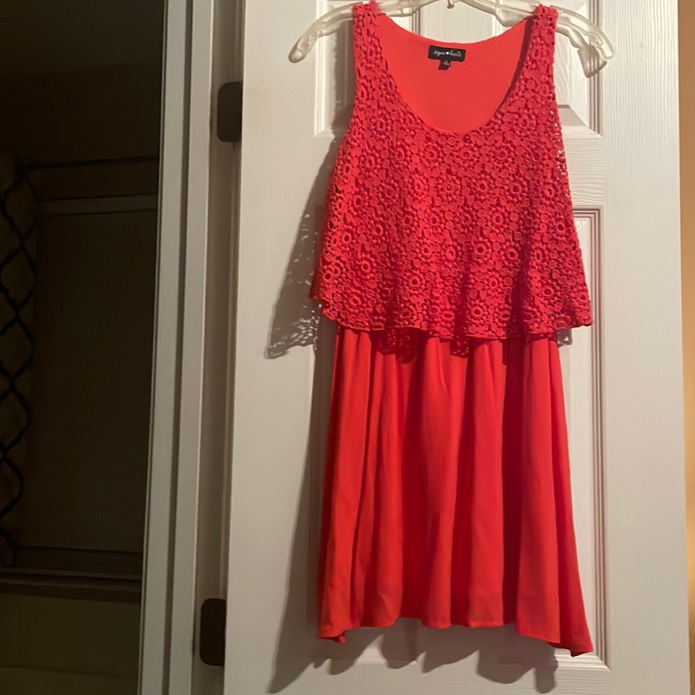 Adorable, comfortable, stretchy mini dress Lacey top rayon bottom.